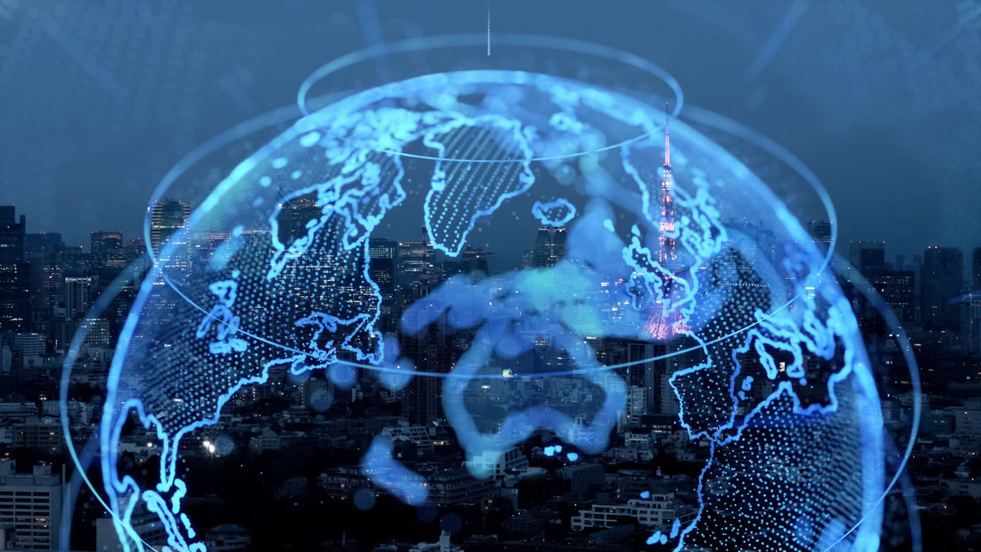Digital blue holographic globe overlaying a glowing city skyline at night.