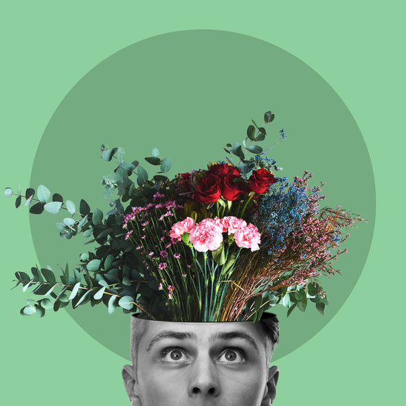 Surreal art collage of a man's face with a colorful bouquet of flowers as a brain.